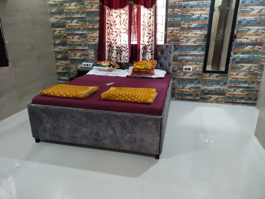 Air conditioned bedroom with attached bathroom at the Lonavala villa